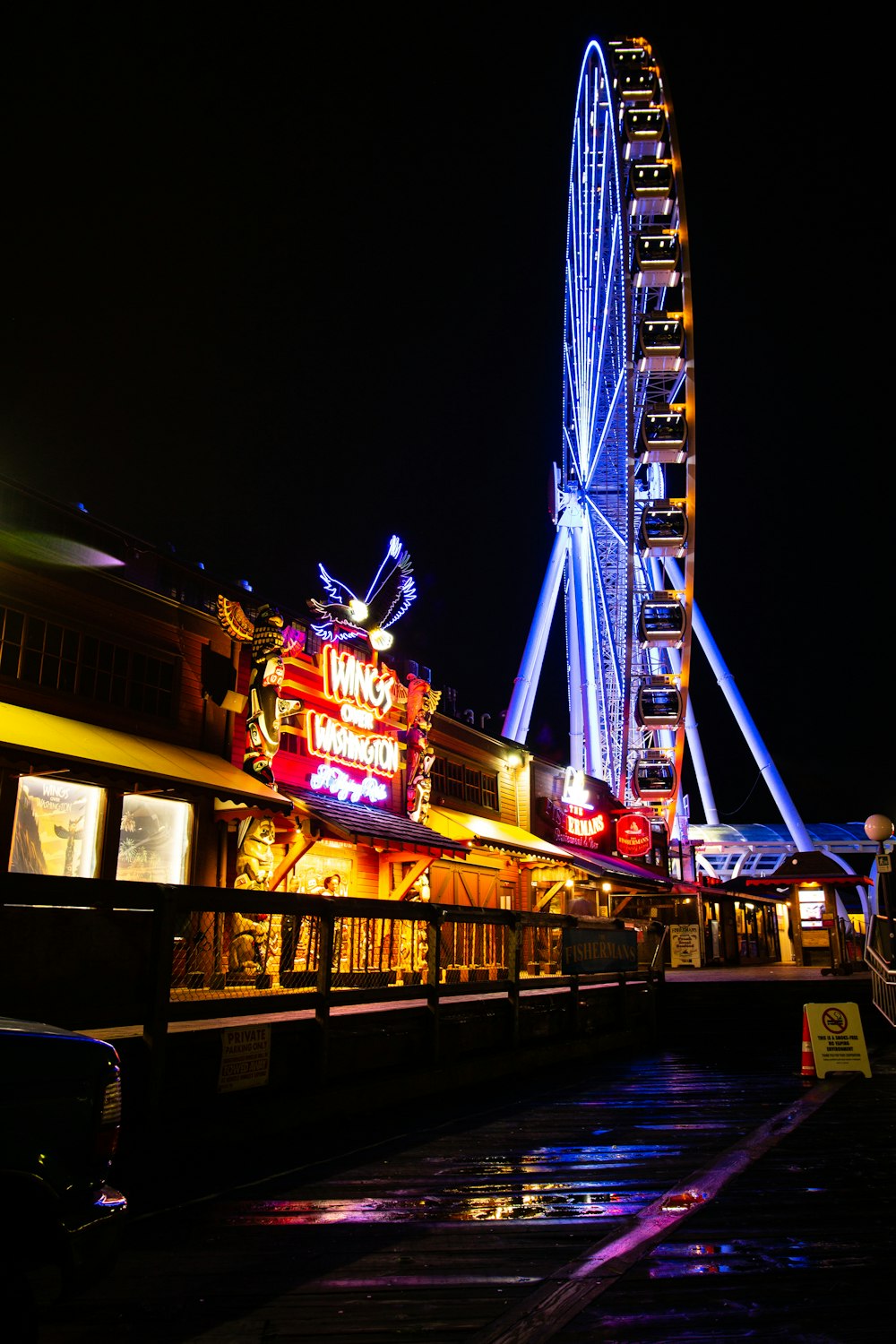 Ferris wheel at the amusement park during night