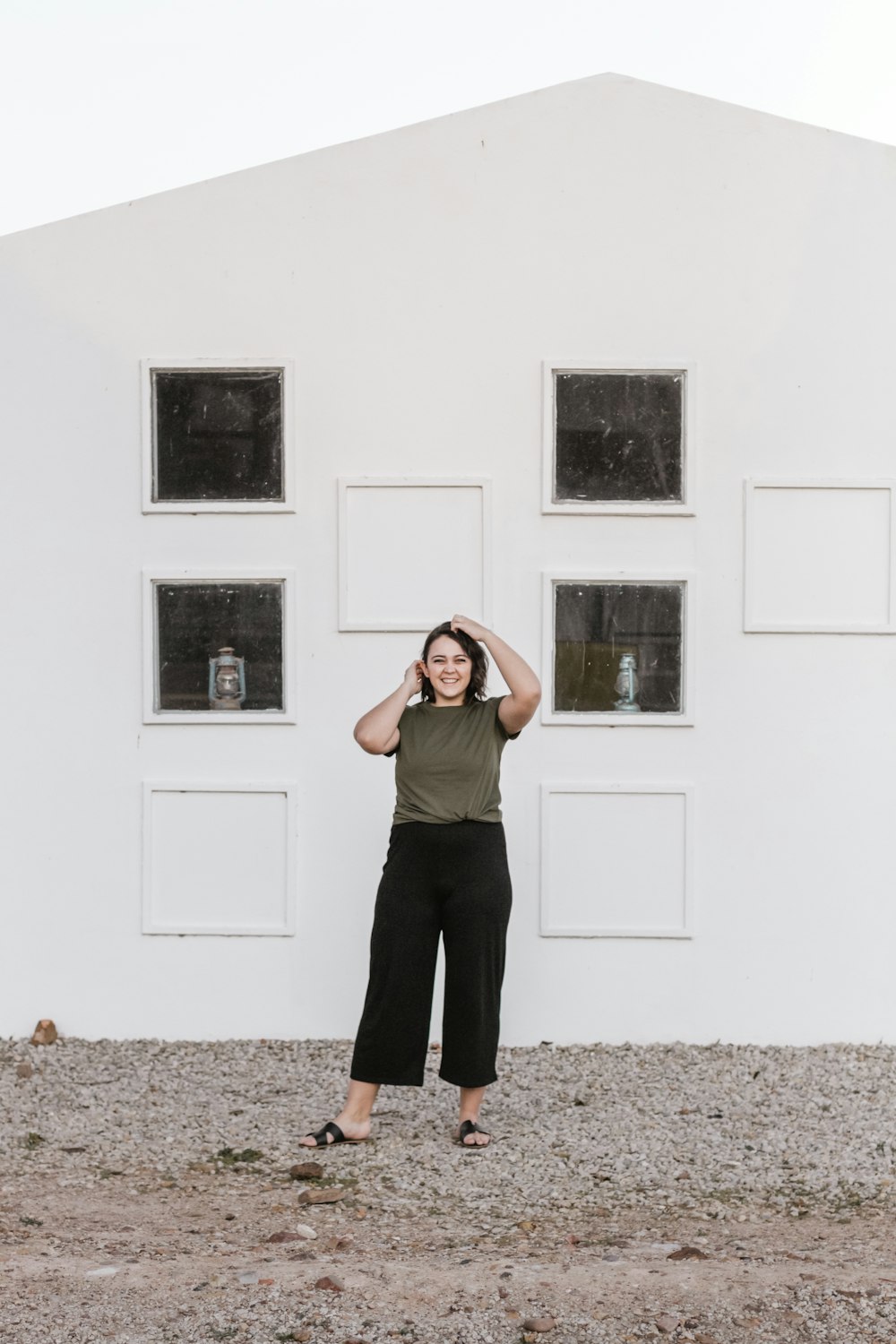 shallow focus photo of woman in black pants