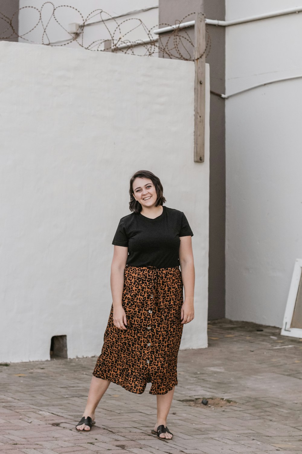 shallow focus photo of woman in black and brown dress