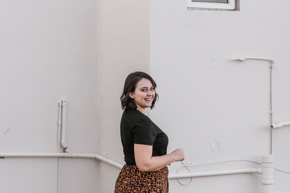 woman standing near wall