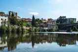 A peaceful riverside view of San Nazzaro Sesia showing natural landscapes and small town charm.