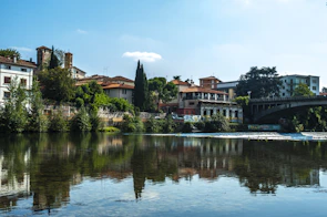 A peaceful riverside view of San Nazzaro Sesia showing natural landscapes and small town charm.