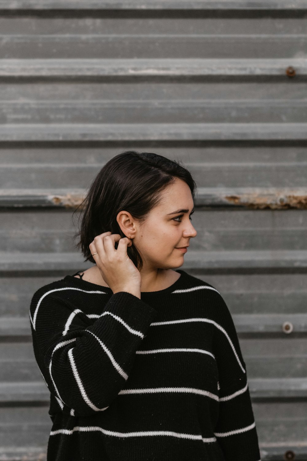 woman holding her hair