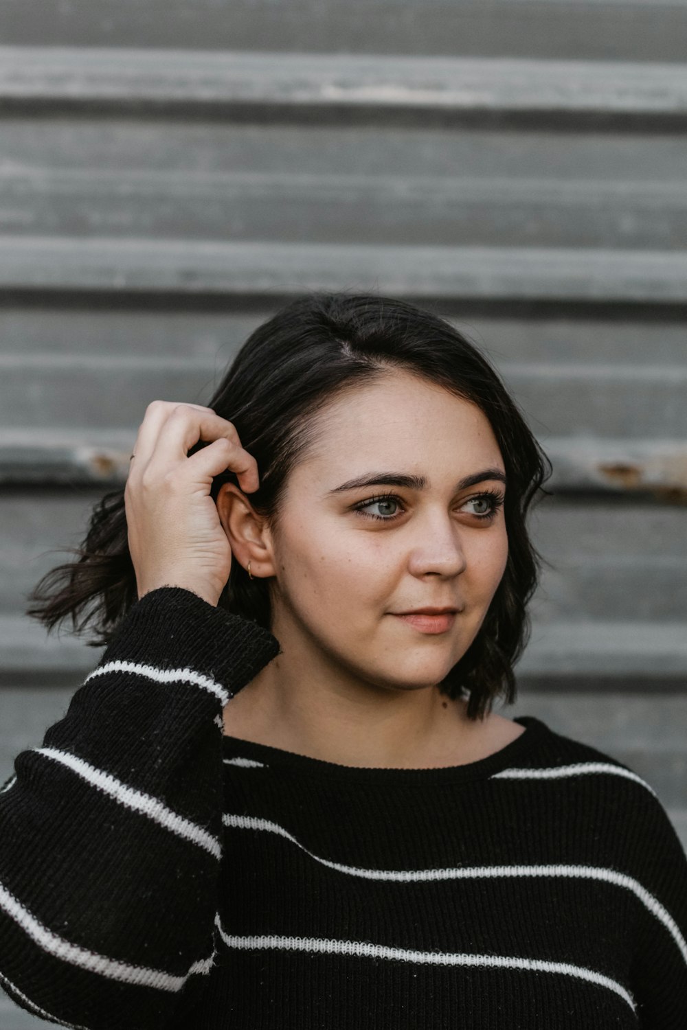 woman holding her sweatshirt