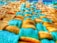 A close-up of a textured fabric with a woven pattern, featuring a combination of yellow and teal colored fibers. The fabric appears soft and plush, with a detailed view of both smooth and textured surfaces.