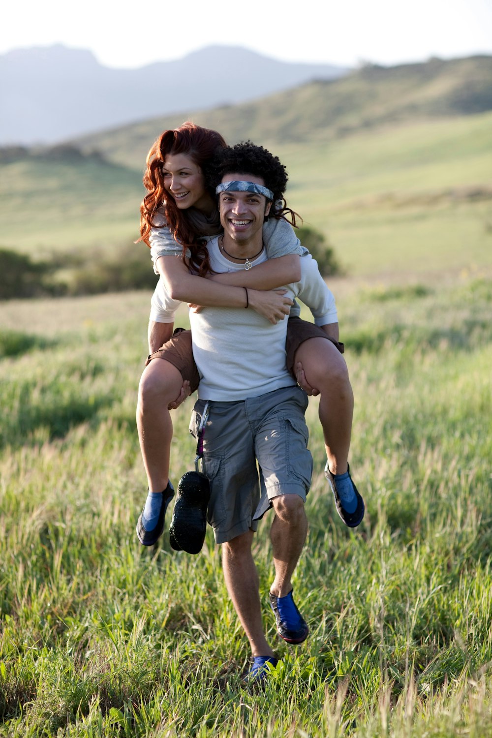 man carrying woman