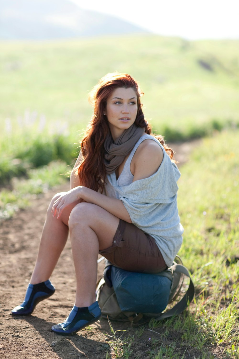 woman sitting on bag