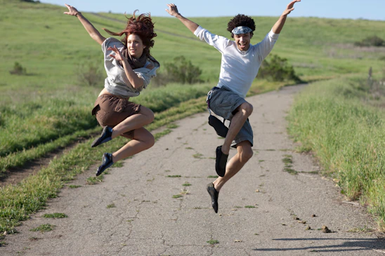 man and woman jumping