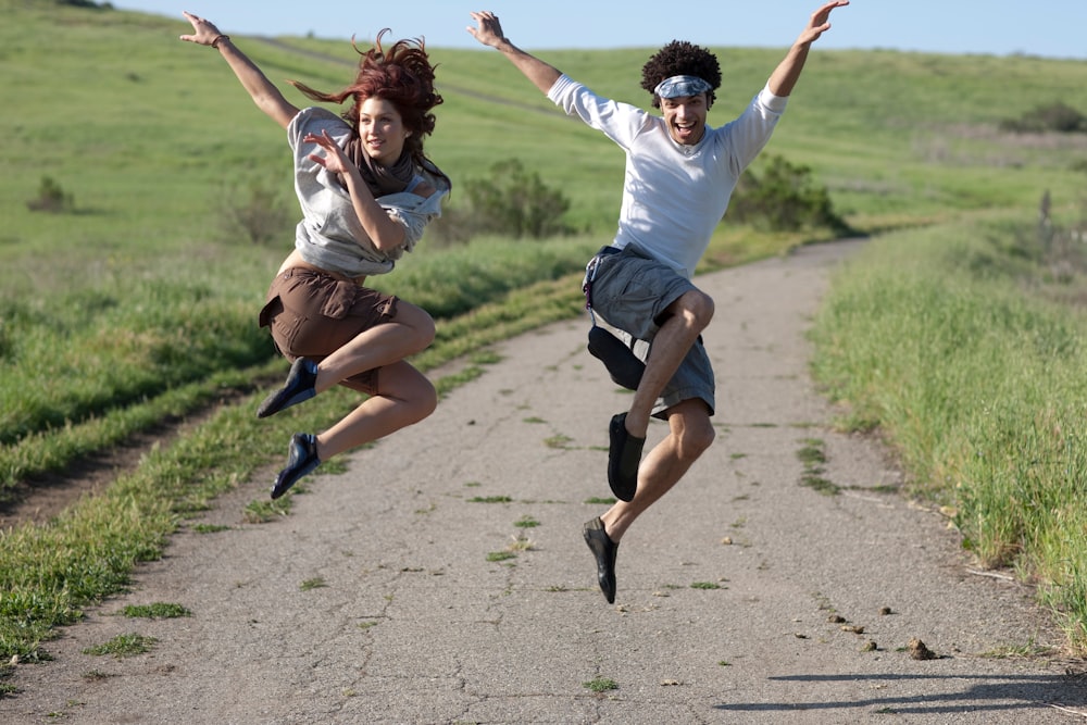 man and woman jumping