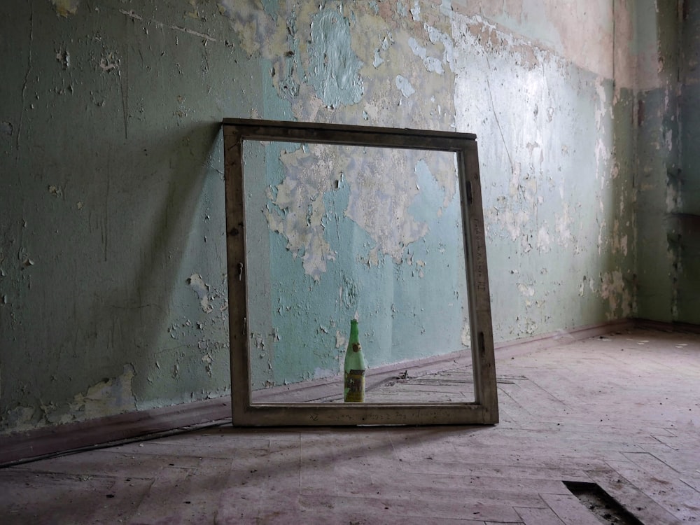 bottle inside wooden frame