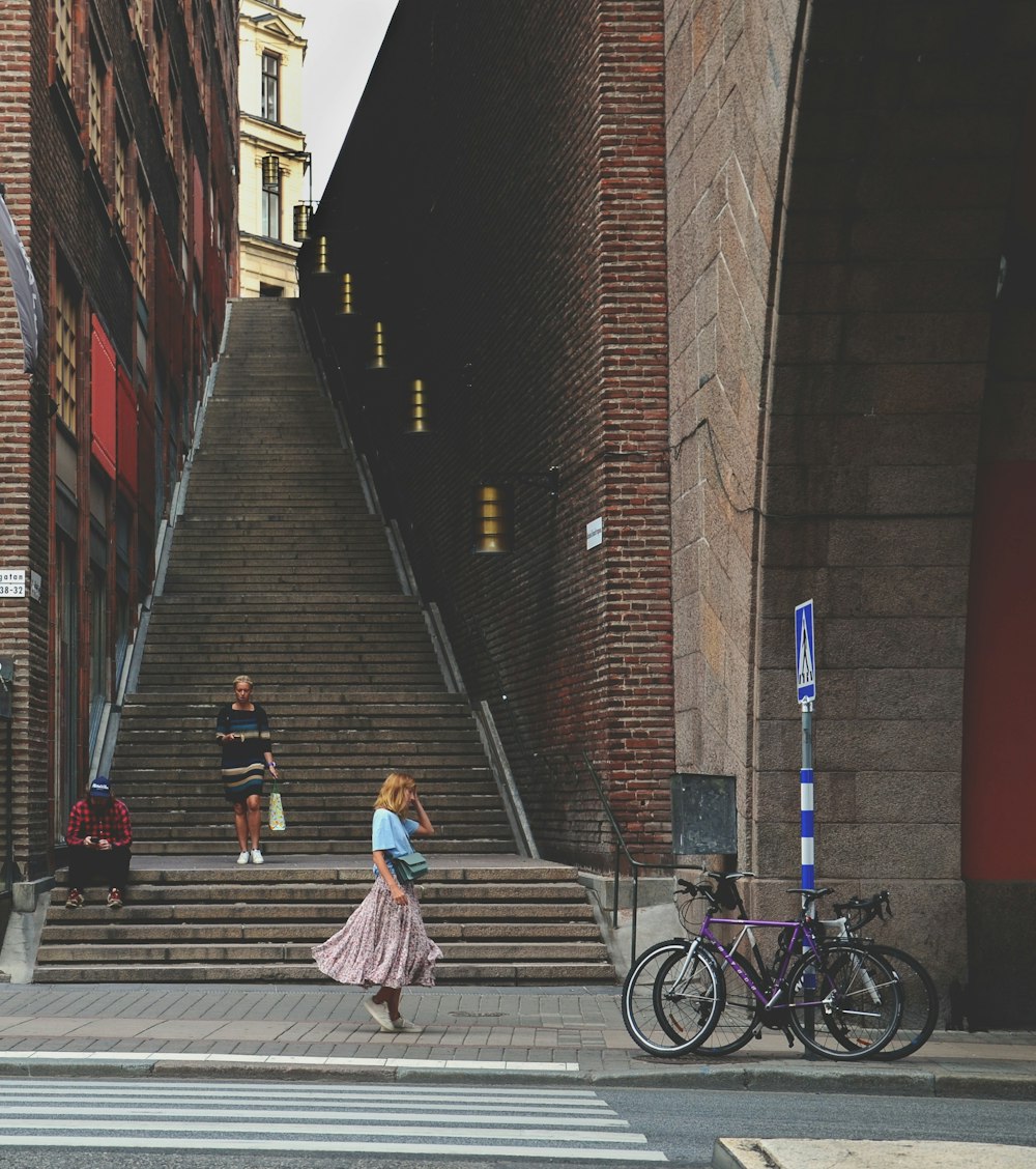 woman walking beside stairs
