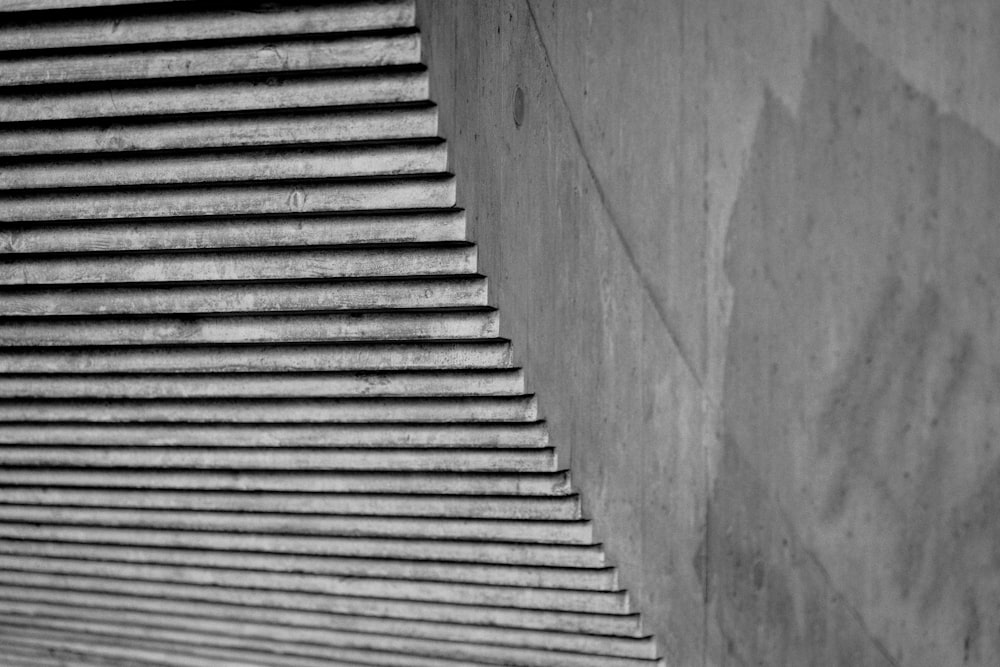 a black and white photo of a skateboarder doing a trick