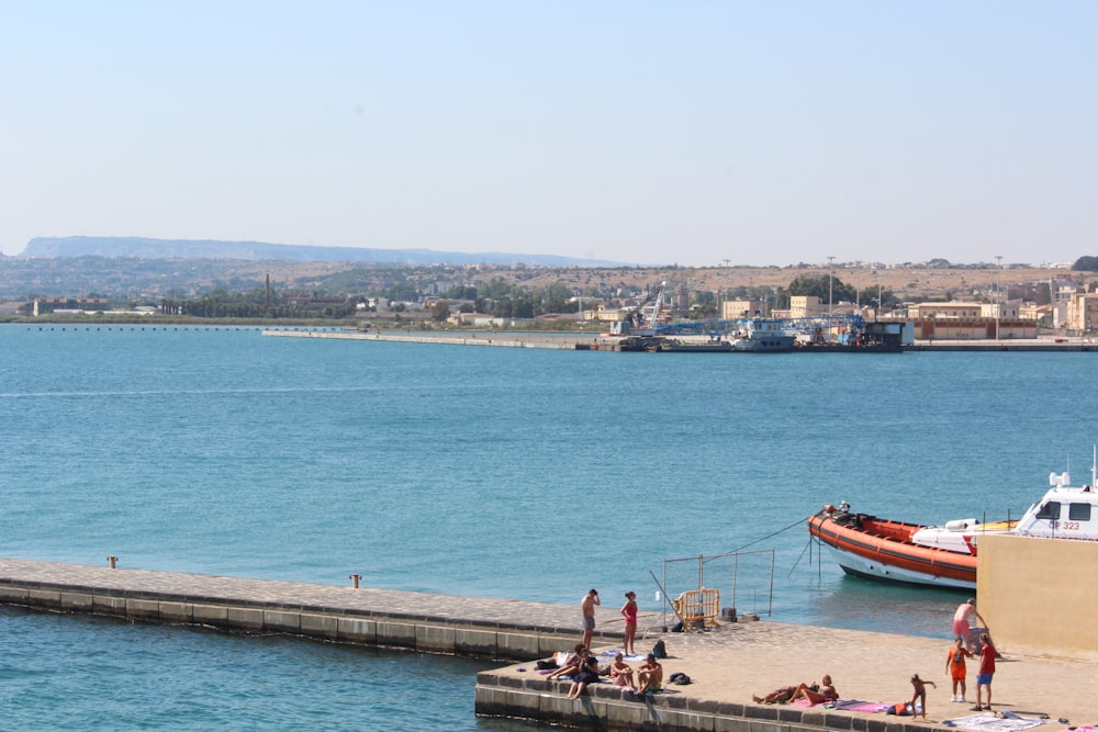 people on concrete pier