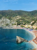 a beach that has a lot of people on it