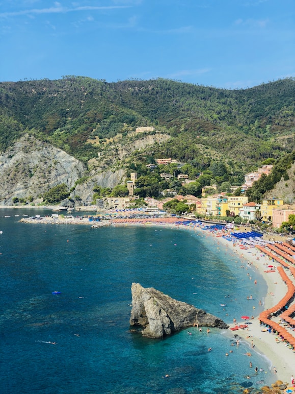 a beach that has a lot of people on it