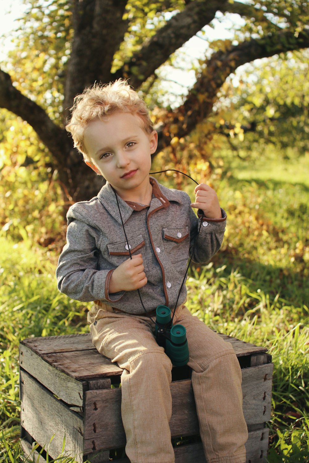 boy wearing grey jacket