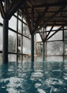A serene indoor pool surrounded by calming decor and soft lighting, providing a peaceful escape for guests to unwind.