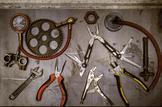 Assorted hand tools used to service a State water heater