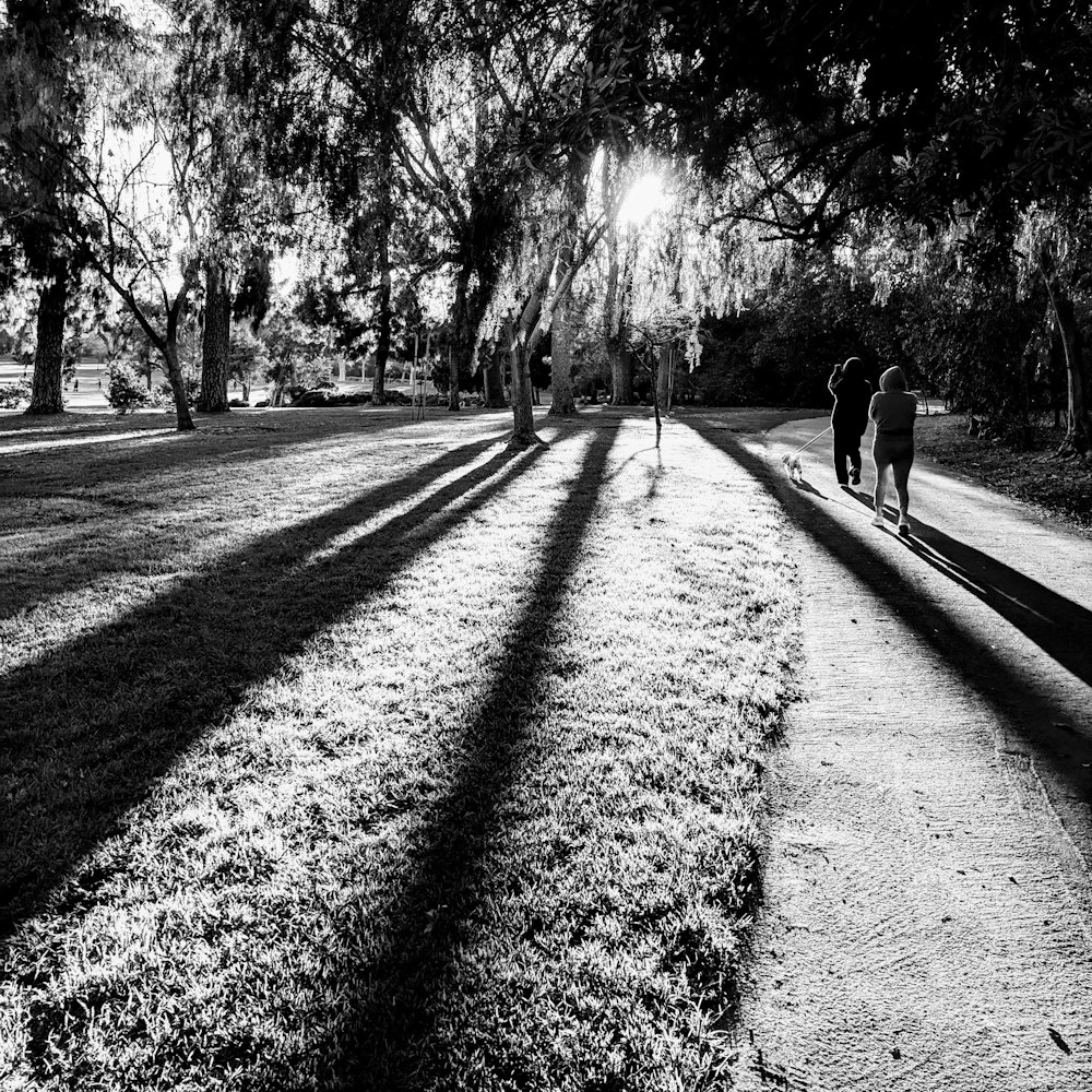 two women walking on pathway