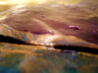 Close-up of a richly textured faux finish wall with subtle metallic highlights.