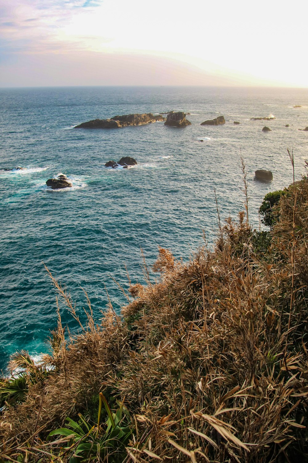 rock formations on blue sea during daytime