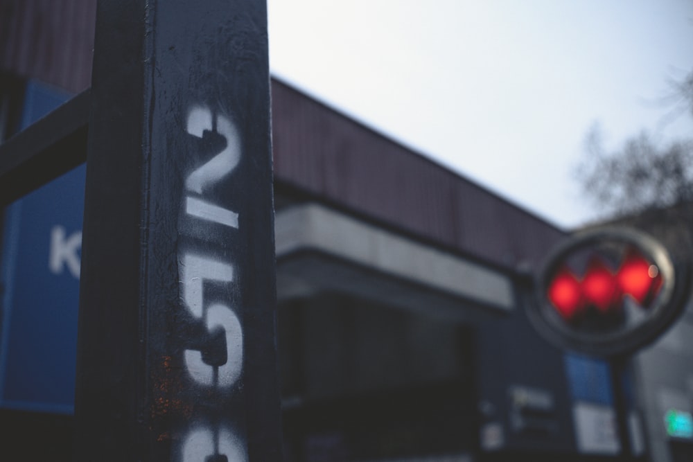 a stop light that has some graffiti on it