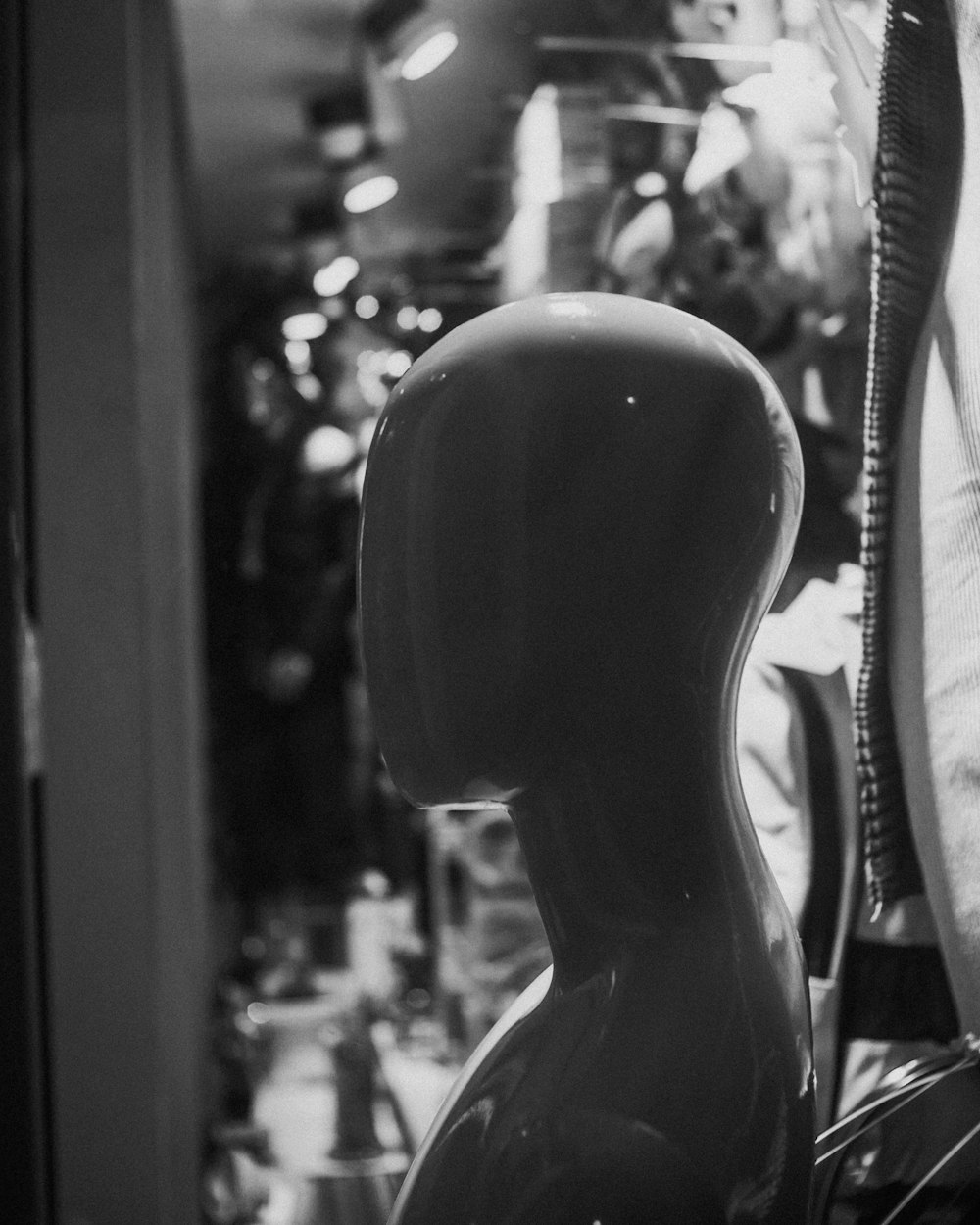 a black and white photo of a mannequin head