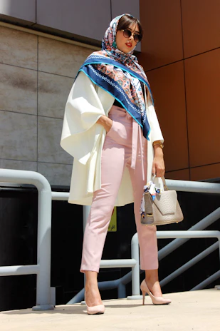 Chic casual look with a white top and pink scarf, styled for a relaxed day out.