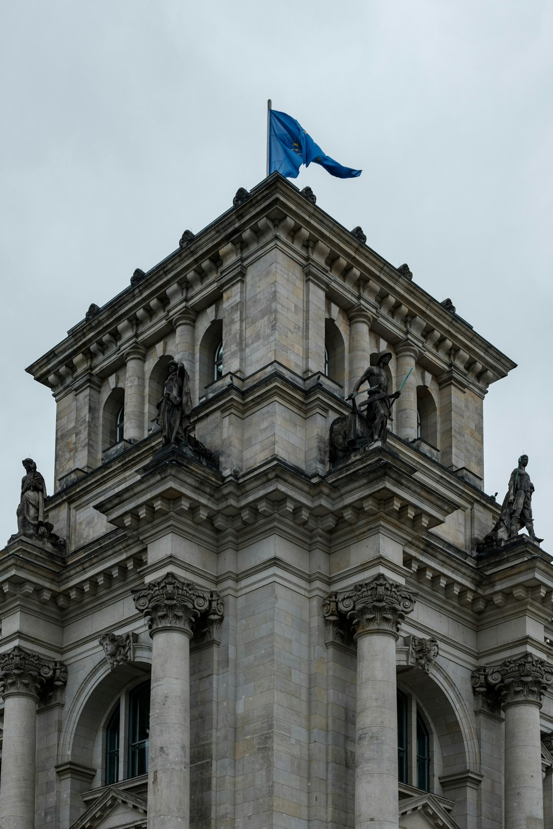 building with blue flag on top