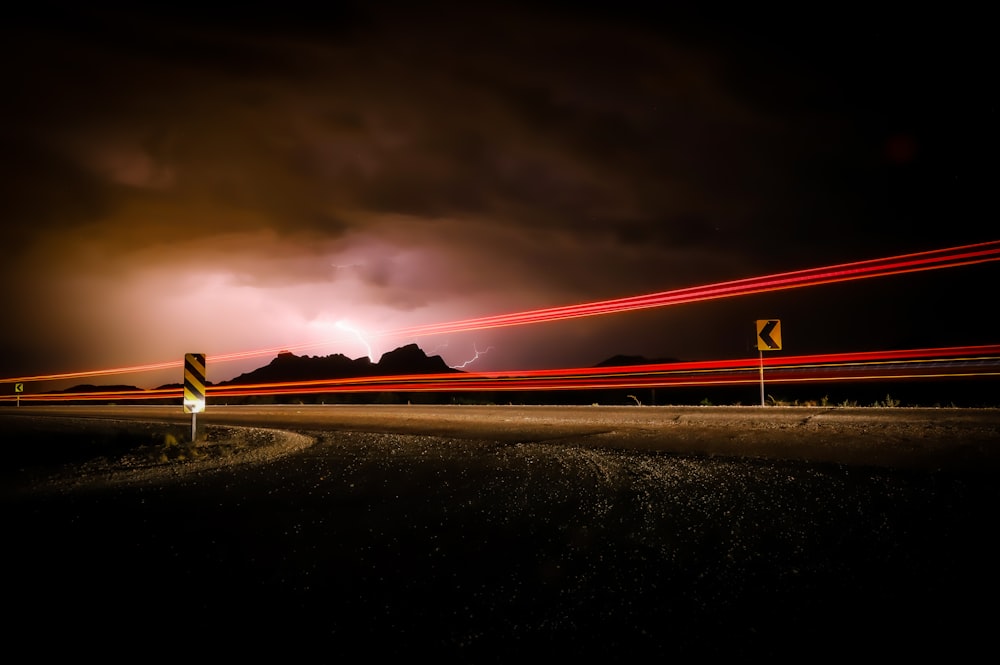 time lapse photography of road during night time