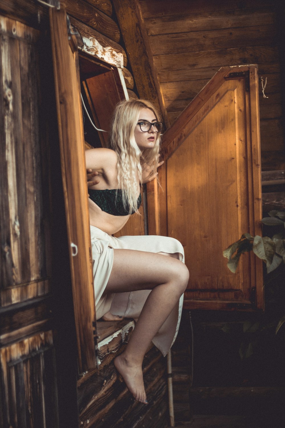 woman sitting on wardrobe