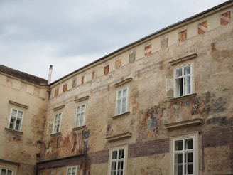 Restored building facade showing fresh paint and detailed masonry