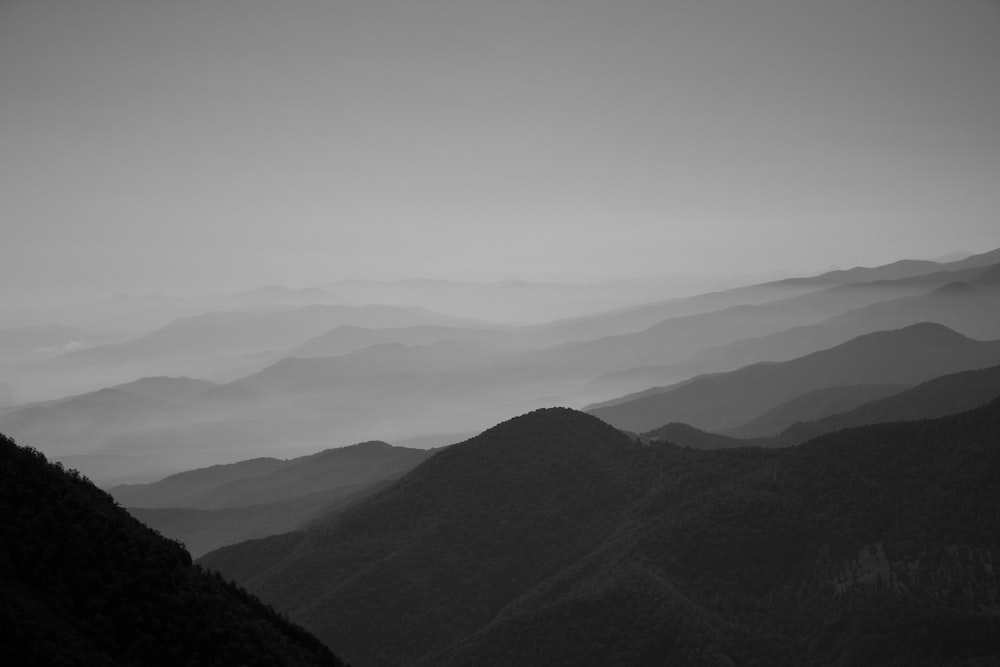 a black and white photo of a mountain range