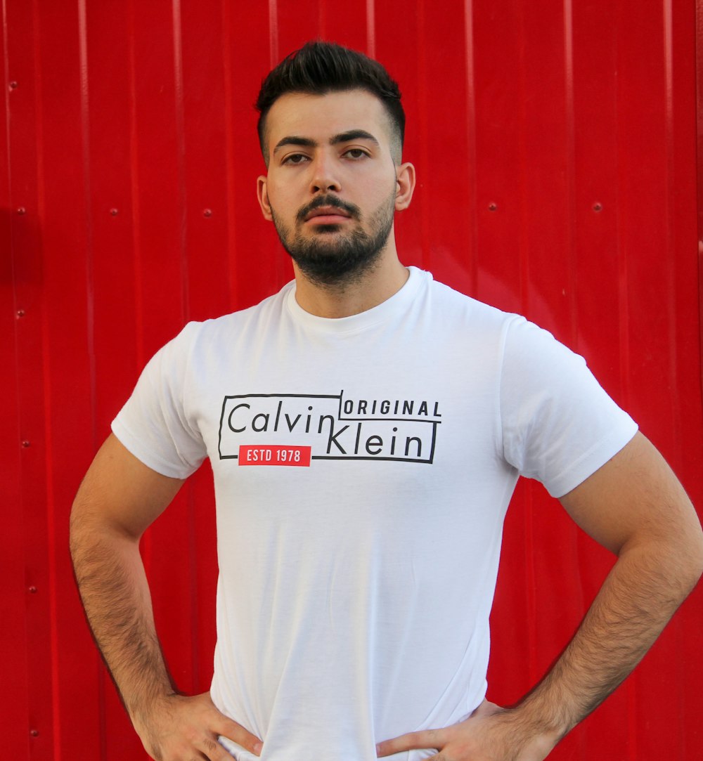 man wearing white Calvin Klein crew-neck t-shirt