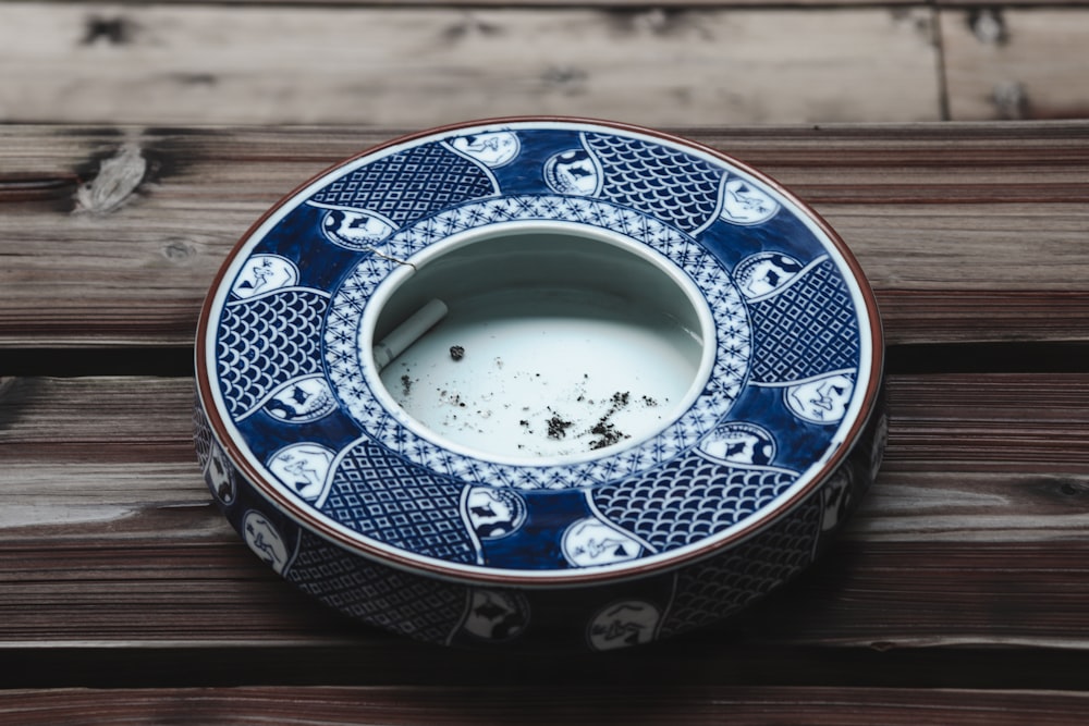 round blue and white ceramic ashtray