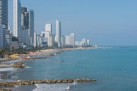 A panoramic view of Dar es Salaam’s coastline with jet skis dotting the sparkling sea.