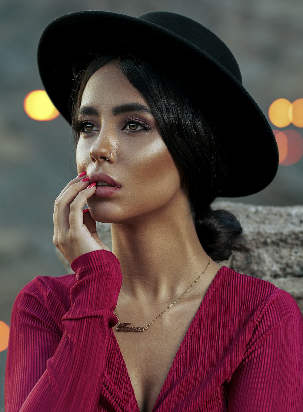 woman wearing round black hat