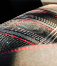 black, gray, and red plaid textile macro photography