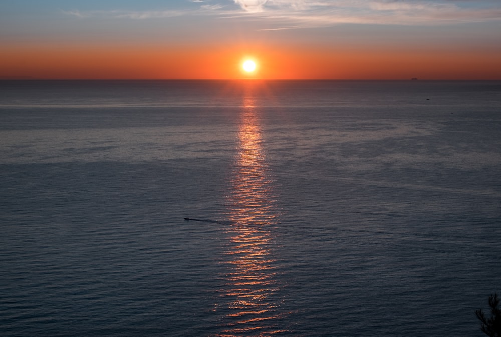 body of water during golden hour