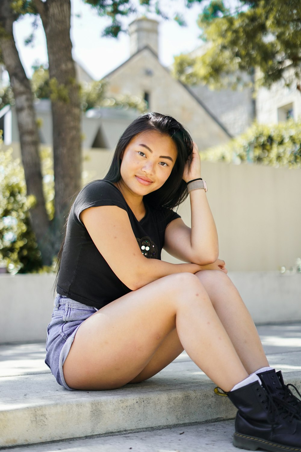 woman sitting on walkway