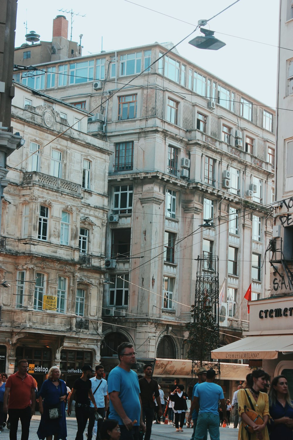 people standing near buildings at daytime