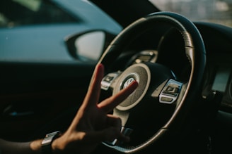 Close-up of hands shaking in agreement with a Volkswagen brochure on the table.