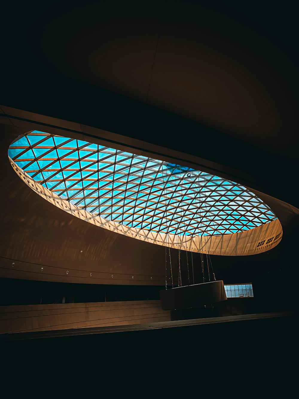 a building with a glass roof and a clock