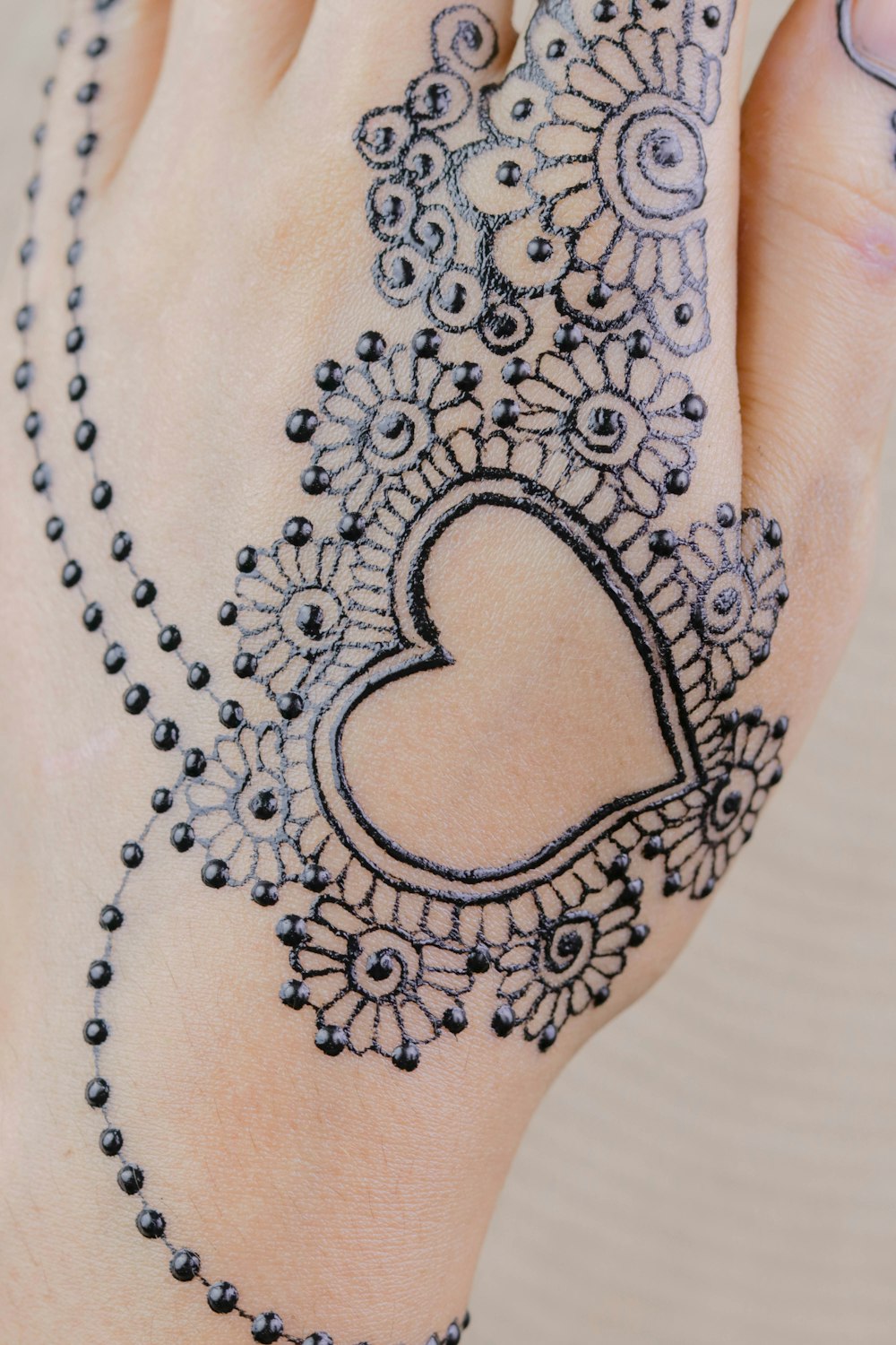 black floral mehndi tattoo