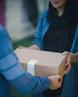 person giving brown box