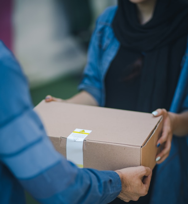 person giving brown box