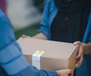 person giving brown box