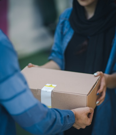 person giving brown box