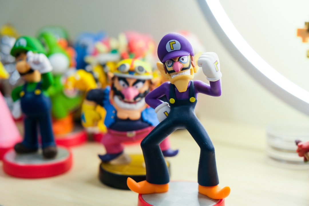 Nintendo amiibo toys of characters of Waluigi, Wario, and Luigi