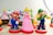 Mario, Luigi, and Princess Peach figurines